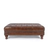 Voetenbank met capitonnage in echt bruin leer